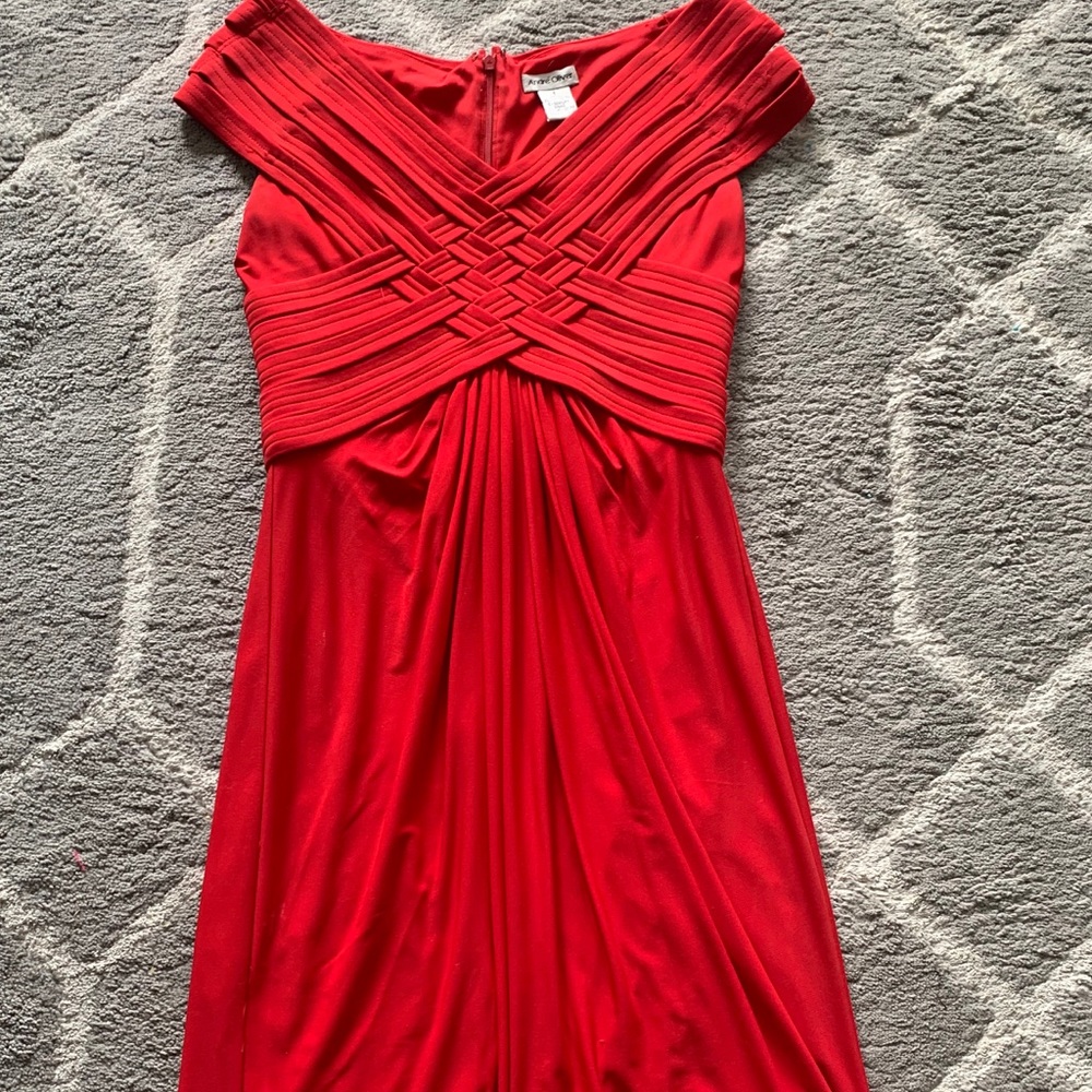 Andre Oliver, Gorgeous red dress over the knee length.